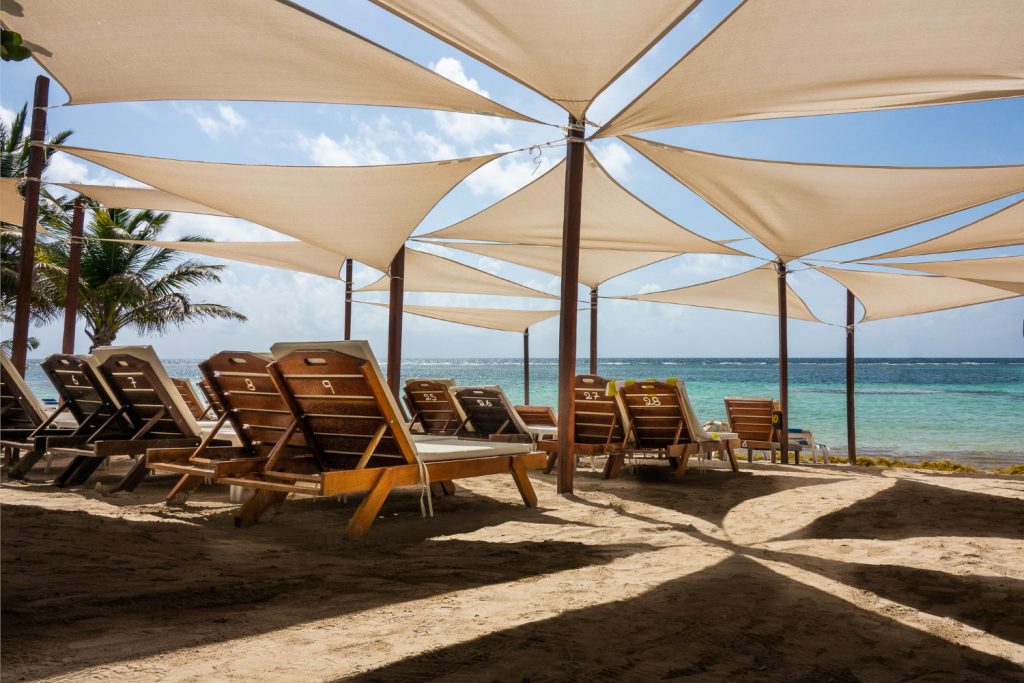 sun loungers put each other umbrellas beach